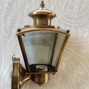 Sea Gull Outdoor Wall Lamp in antique gold finish. 100w max